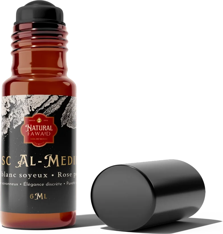 Flacon roll-on Musc Al-Medinah de 6 ml, étiquette noire et blanche, avec son bouchon noir posé à côté.