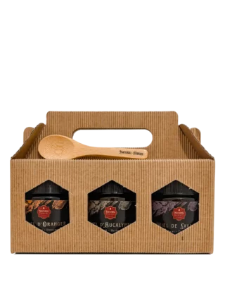 Coffret de trois miels marocains Essentiels Natural Fawaid dans boîte kraft.