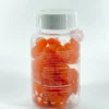 gummies-collagene-plus-ziyada-x60-composition Gummies roses au collagène posés sur une coiffeuse à côté d'une crème et d'une serviette