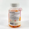 gummies-no-stress-safran-ziyada Gummies orange posés près de fleurs de crocus violettes et de stigmates de safran rouges